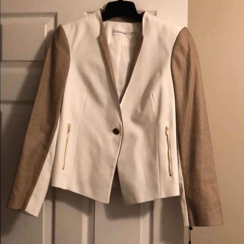 Cream and tweed blazer.